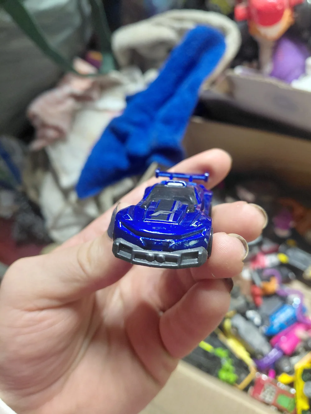 1:64 scale Hot Wheels Track Ripper in metallic blue